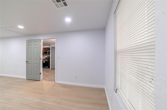 unfurnished room featuring light hardwood / wood-style floors