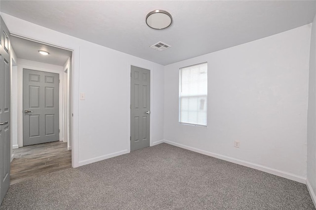 unfurnished bedroom featuring carpet flooring