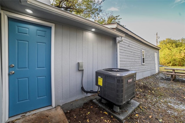 doorway to property with central AC unit