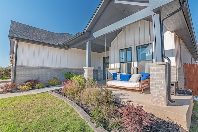 exterior space with a lawn and a porch