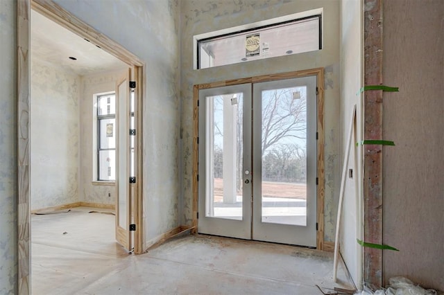 interior space featuring french doors and plenty of natural light