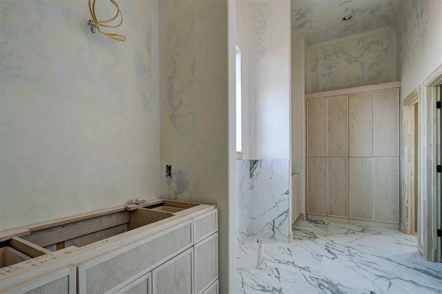 bathroom with marble finish floor