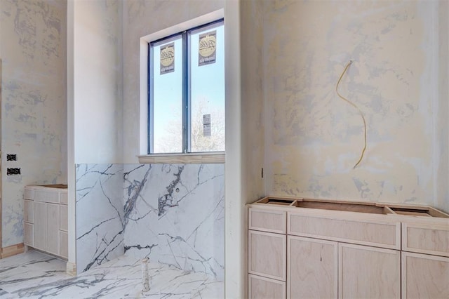 bathroom with marble finish floor