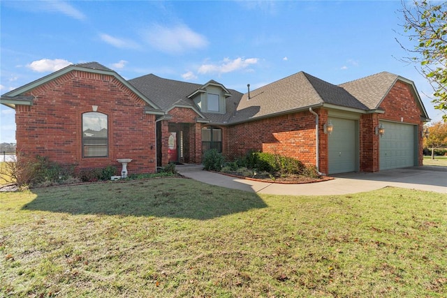 view of front of home featuring a garage and a front yard