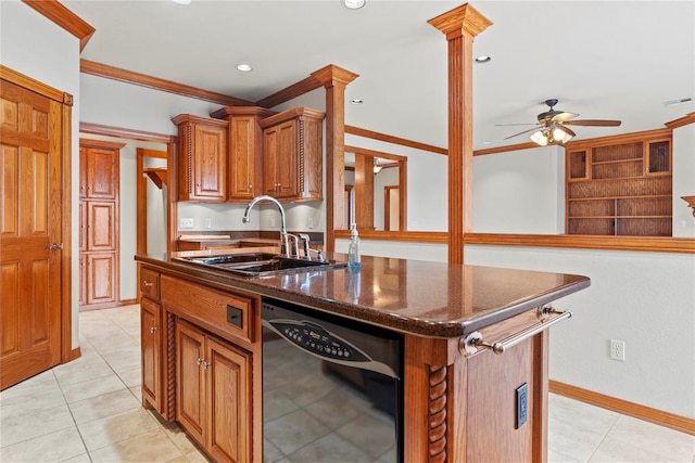 kitchen featuring decorative columns, ceiling fan, sink, black dishwasher, and a kitchen island