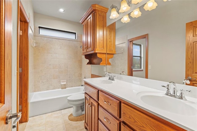 full bathroom featuring toilet, vanity, tile patterned floors, and a wealth of natural light