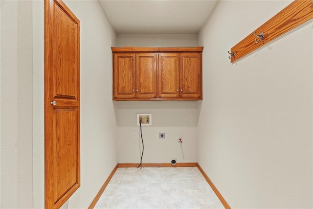 washroom featuring hookup for a washing machine, cabinets, and hookup for an electric dryer