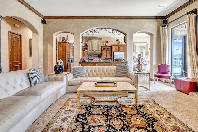 carpeted living room with ornamental molding