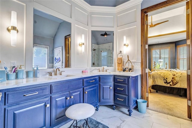 bathroom with vanity, a shower with shower door, and lofted ceiling