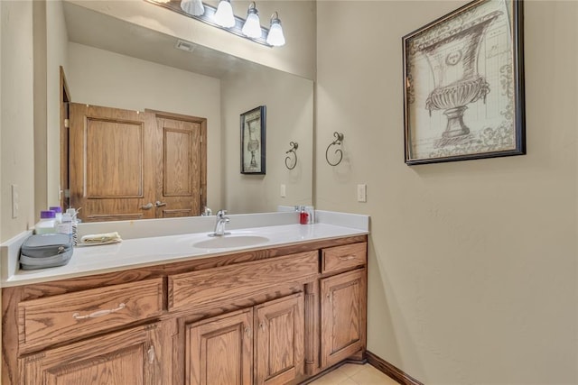 bathroom with tile patterned flooring and vanity