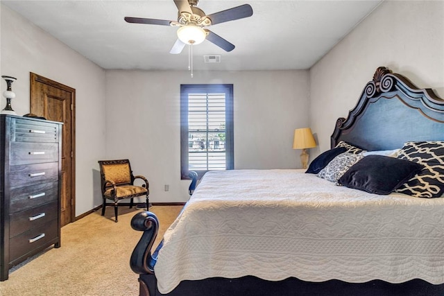 bedroom with ceiling fan and light colored carpet