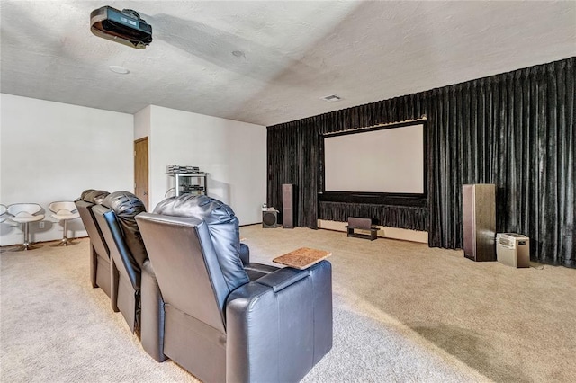 cinema featuring carpet flooring and a textured ceiling