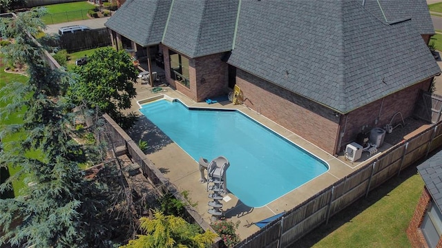 view of swimming pool featuring a patio area