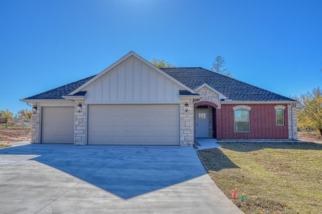 single story home featuring a front yard and a garage