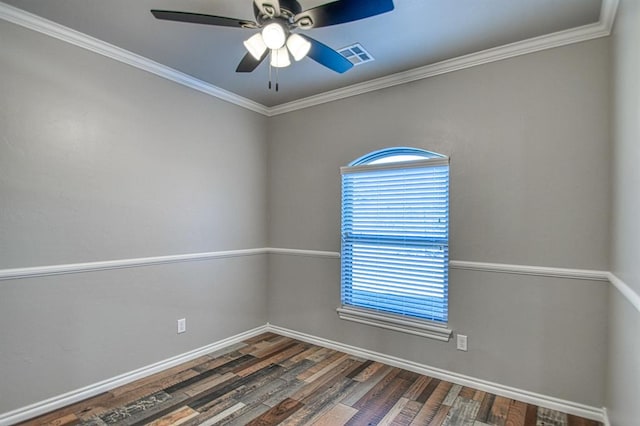 spare room featuring crown molding, ceiling fan, and dark wood-type flooring