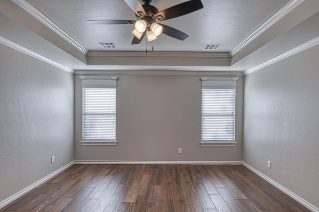 spare room with crown molding, ceiling fan, and dark hardwood / wood-style floors