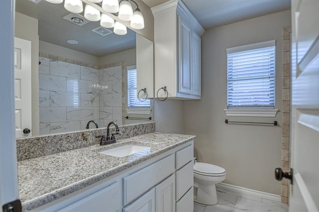 bathroom with vanity and toilet