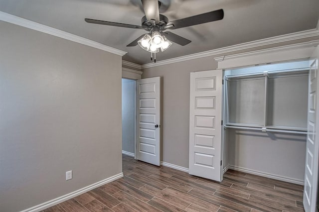 unfurnished bedroom featuring ceiling fan, a closet, crown molding, and dark hardwood / wood-style floors