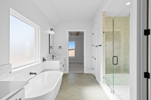 bathroom featuring tile patterned floors, vanity, lofted ceiling, and plus walk in shower