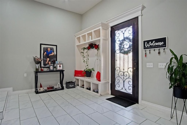 mudroom with light tile patterned floors