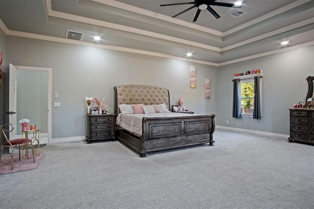 bedroom with a raised ceiling, ceiling fan, light colored carpet, and ornamental molding