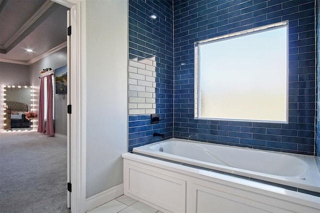 bathroom with a tub to relax in and crown molding