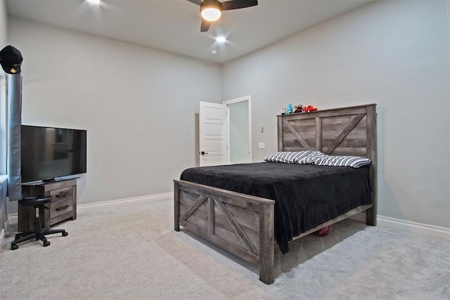 bedroom with ceiling fan and light carpet