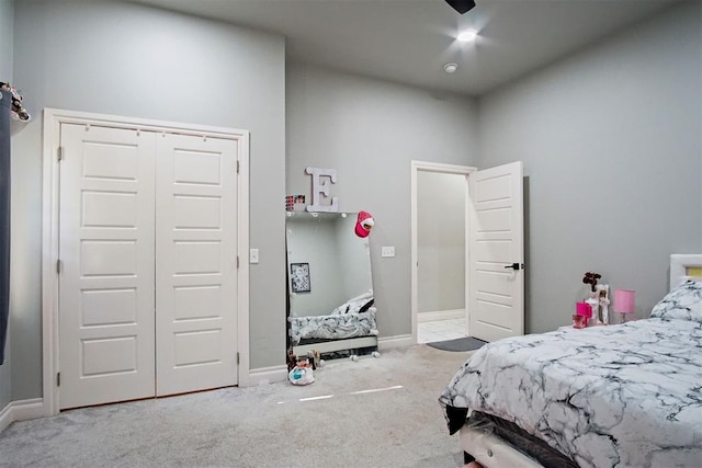 carpeted bedroom featuring a closet