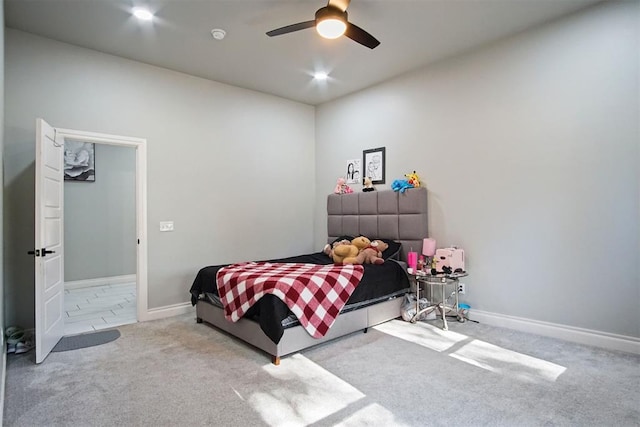 bedroom featuring ceiling fan and light colored carpet