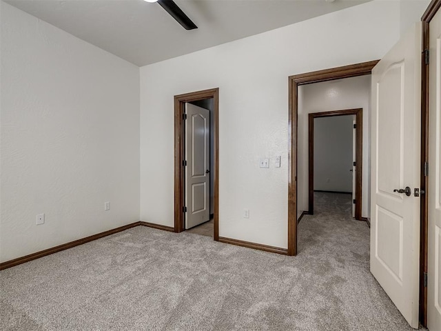 unfurnished bedroom with light carpet and ceiling fan