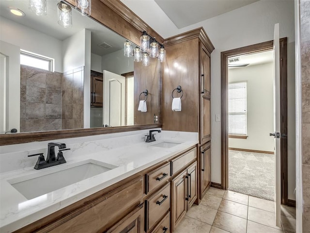 bathroom featuring tile patterned flooring and vanity