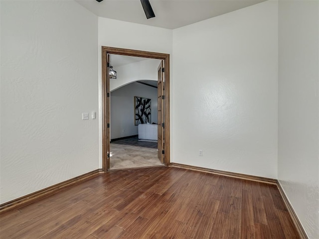 spare room with ceiling fan and hardwood / wood-style floors