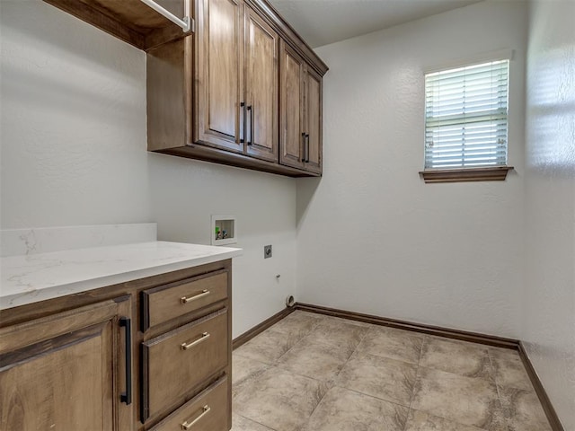 washroom with cabinets, washer hookup, and electric dryer hookup