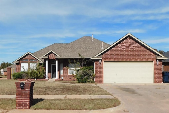 view of front of property with a front lawn and a garage