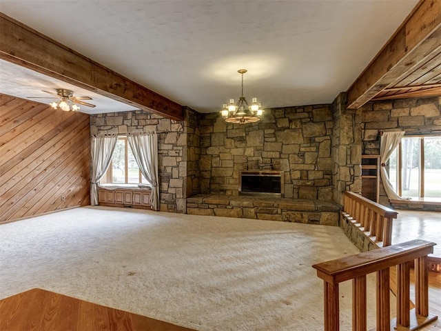 1501 S Avery Ave, Midwest City, OK 73130 - unfurnished living room with healthy amount of natural light, a chandelier, beam ceiling, a fireplace, and carpet floors
