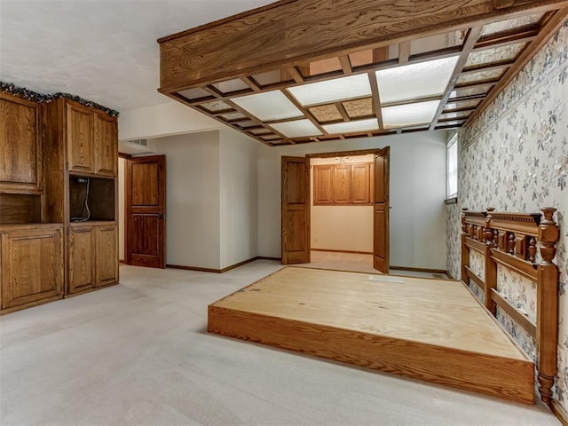1501 S Avery Ave, Midwest City, OK 73130 - unfurnished living room with light colored carpet and baseboards