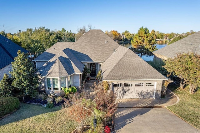 birds eye view of property featuring a water view