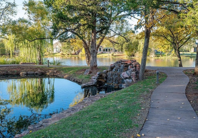 view of community with a water view