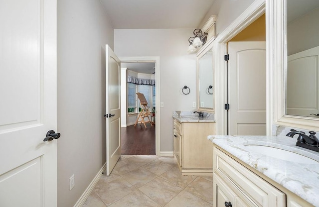 bathroom with vanity and wood-type flooring