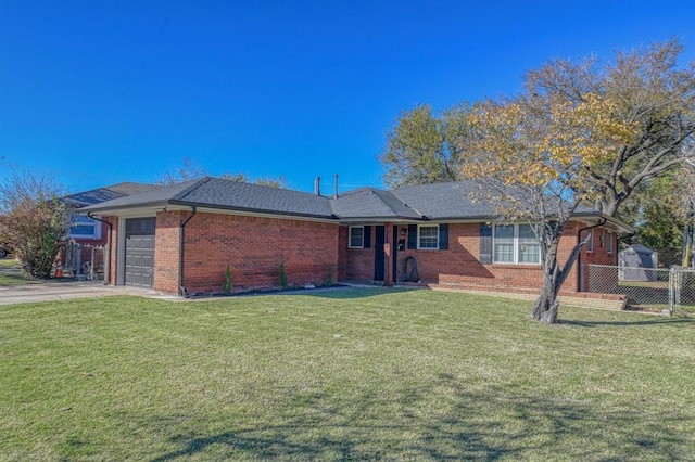 ranch-style home featuring a garage and a front lawn