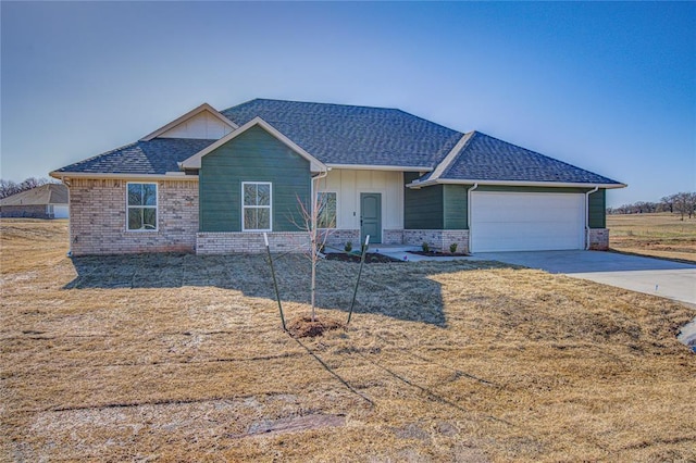 view of front of property with brick siding, a shingled roof, an attached garage, board and batten siding, and driveway