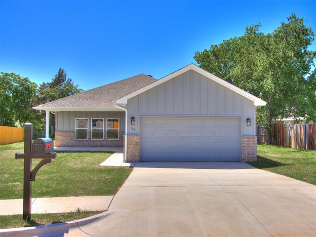 ranch-style home with a garage and a front lawn