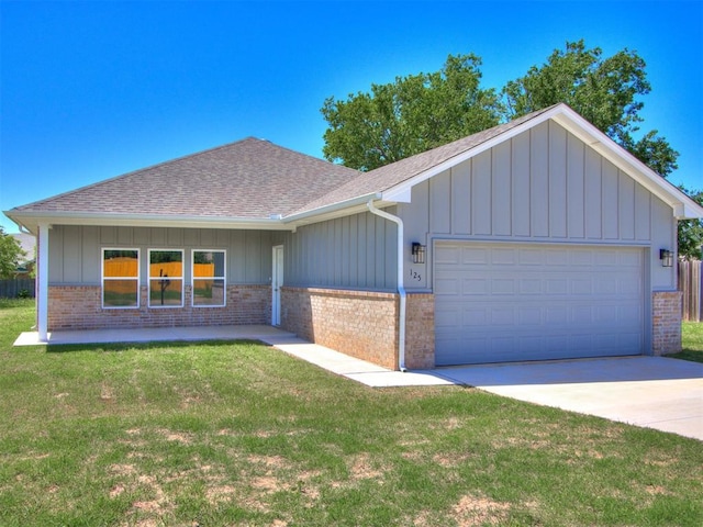 single story home featuring a garage and a front yard