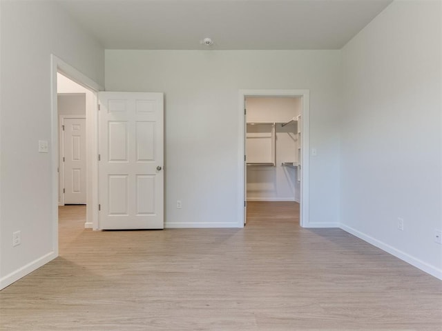 spare room featuring light hardwood / wood-style flooring