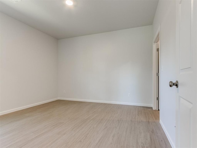 spare room with light wood-type flooring