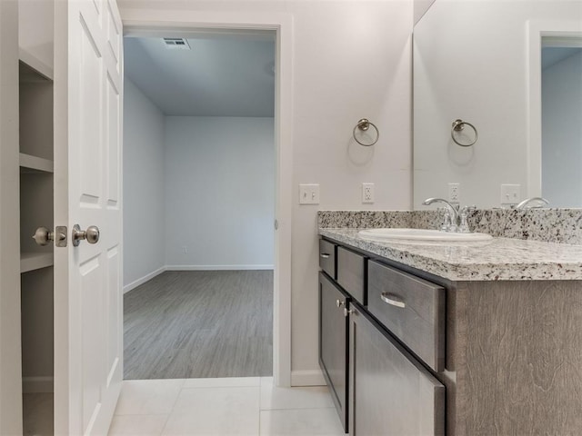 bathroom featuring hardwood / wood-style floors and vanity