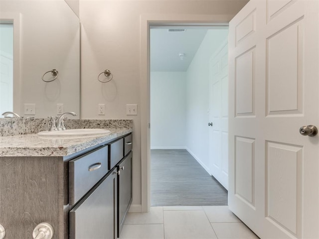 bathroom with hardwood / wood-style floors and vanity