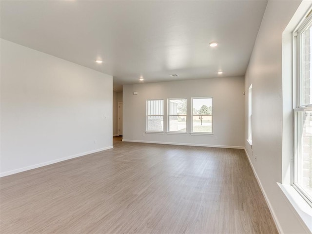 unfurnished room featuring light wood-type flooring