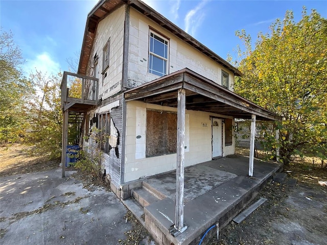 view of side of home with a patio