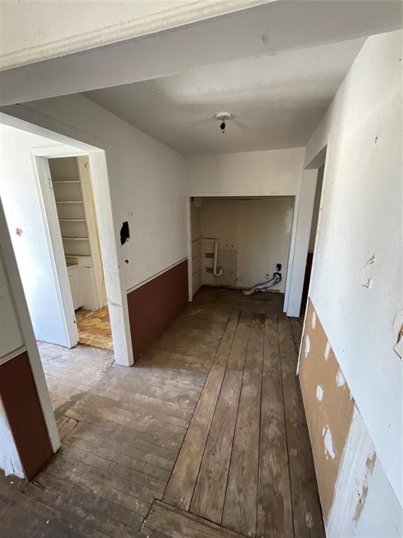 corridor with dark hardwood / wood-style floors